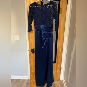 Long, dark blue, formal, satin dress. Lace on top, satin on bottom.